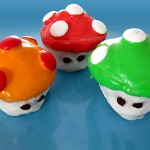 A variety of Super Mario Brothers Mushroom cupcakes
